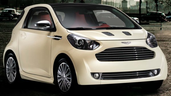 И все пак от Aston Martin взеха Toyota iQ, поставиха нова решетка, кожа в салона и направиха Aston Martin Cygnet. Той беше три пъти по-скъп от японския си братовчед, от който наследи и двигателя (1,3-литров, 4-цилиндров с 99 к.с.), но идеята се оказа пълен провал и автомобилът се задържа в производство само 3 години.