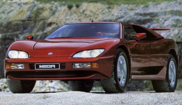 Mega Track въщност е Lamborghini LM002 от паралелна вселена - в случая брутален рамен всъдеход с двигател на суперкола. Четириместното купе със средно разположение на мотора има клирънс от 220 мм и задвижване на четирите колела. Машината се появи на автосалона в Женева през 1992 г. и веднага се превърна в хит, но бавното преминаване към серийно производство му изигра лоша услуга.

В крайна сметка от френската суперкола бяха произведени само 5 бройки (според някои сведени - 11). Всички те получават уникална система за задвижване на четирите колела, пневматично окачване, а също така двигател и скоростна кутия от Mercedes-Benz S 600 W140. Затова Mega Track ускорява от 0 до 100 км/ч за 6 секунди, а максималната му скорост е 250 км/ч.
