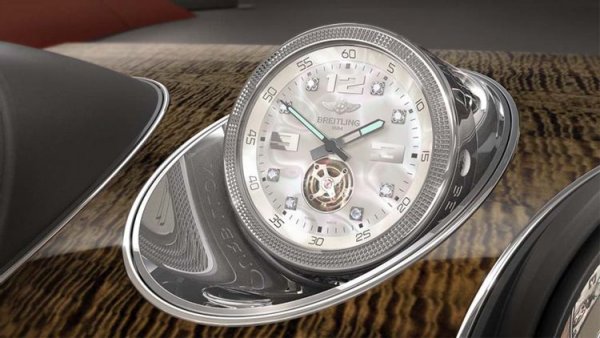Изящният часовник Tourbillion е на цена от невероятните 170 000 долара и е най-скъпата опция, предлагана в момента за луксозния SUV. За да може да се добие някаква представа за тази цена, ще посочим, че най-евтината модификация на Bentayga на пазара днес - Bentayga Hybrid, струва приблизително 180 000 долара!

Както се очакваше, това не е обикновен часовник, а такъв, изработен по поръчка за автомобила от фирмата Breitling. Той е напълно механичен, с изключение на малък електрически мотор, който върти часовника толкова често, за да гарантира, че никога няма да остане без енергия.