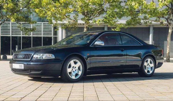 В края на 90-те години Audi започва сериозно да обмисля създаването на луксозно пълноразмерно купе, което да се конкурира с подобни модели от други германски марки. За да се ограничат разходите за разработка, е решено да се вземе за основа седанът A8 от първо поколение и да се превърне в двуврато купе в стил гранд турър.

Проектът е връчен на мюнхенската компания IVM Automotive, чиито специалисти сериозно преработват каросерията на стандартния седан от бизнес клас. Резултатът е представен на автомобилното изложение в Женева през 1997 г. Елегантното купе без централни колони и с напълно преосмислен интериор прави силно впечатление на публиката.

