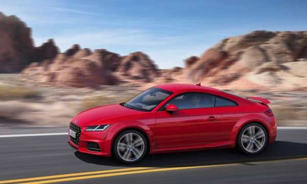 Audi нарече модела TT (Tourist Trophy) след състезание с мотоциклети, което всяка година се провежда на остров Ман. Там пилотите се борят за "Туристическия трофей", което не би трябвало да има връзка с компания като Audi, която никога не е произвеждала масови мотоциклети, а камо ли да участва в надпреварата.

Всъщност, една от компаниите, които се сливат в Audi преди близо век - DKW, прави състезателните мотоциклети и един от тях печели ТТ през 1938 г. Друга от марките - NSU, също побеждава в надпреварата, като нейни машини се класират на първите 4 места в клас до 250 куб. см.
 
Инициалите се появяват първо на мотопeд, а през 1965 г. излизат и спортните версии  Prinz TT и TTS, които се радват на успешна кариера. Именно на тях Audi отдава почит с концептуалното TT, а след това запазва името и за серийния модел. 
