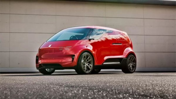 Ако някога сте искали доказателство, че дизайнерският отдел на Porsche понякога може да се побърка напълно, вижте Vision Renndienst. Това е по същество миниван. Футуристичен, електрически, шестместен автомобил, създаден не за поставяне на рекорди на пистата, а за превоз на хора.

Renndienst или "състезателна услуга" от немски е замислен през 2018 г. като част от програмата за невидими концептуални решения на Porsche, серия от дизайнерски експерименти, които марката никога не възнамерява да пусне в производство, но използва, за да разшири границите на собствената си визия. Мислете за него като за скицник на Porsche, но вместо скици, се правят пълноразмерни прототипи.

На пръв поглед Vision Renndienst изглежда по-малко като Porsche и по-скоро като нещо, което стартъп компания от Силициевата долина би представила като "Uber 2035". Монолитната каросерия няма остри ръбове и решетка, само елегантно, обтекаемо дъно с колела. Единственият намек за Porsche е гербът отпред и светлинната лента по цялата ширина на задната част, заимствана от Taycan. Всичко останало крещи: "космически ван".
