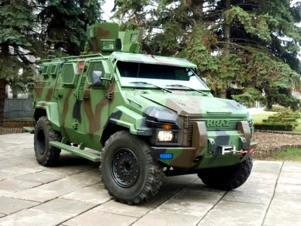 Бронираният автомобил с това име е продукт на украинския автомобилен производител КрАЗ, но вкъщност той е направен по патент на канадската компания STREIT Group Spartan. В основата на автомобила е шасито на споменатият вече модел Ford F550 с 6,7-литров V8 под капака. 
