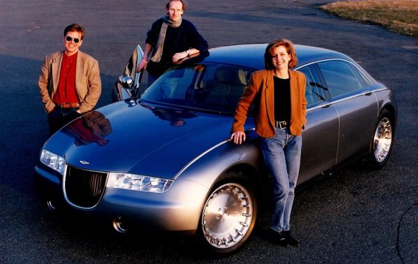 Мори (на снимката вляво) проектира този концепт в Ghia по поръчка на Aston Martin, където по онова време работеше големият му брат Иън. Проектът бе добре приет, но впоследствие тогавашният собственик на бранда Ford реши да не рискува с инвестиция в четириврат Aston. 
