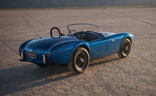 Строго погледнато, легендарната Cobra е всъщност английски АС Асе, на който предприемчивият Каръл Шелби е монтирал американски мотор и подсилено окачване. Но колата се продава именно под марката Shelby Cobra и, което е по-съществено, се продава на съвсем различни цени от оригиналния Асе. Първата произведена бройка, която неизменно бе собственост на самия Каръл до смъртта му, бе продадена на благотворителен търг през 2016 и донесе 13.75 млн. долара. Това е и най-скъпият американски автомобил в историята. 
