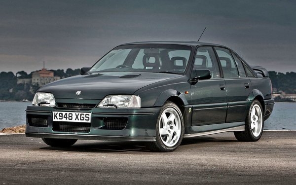 Той е също и Vauxhall Lotus Carlton, като се произвежда през периода 1990-1992 г. В основата на този проект е седанът Opel Omega A, чиято топ-версия е оборудвана с 3,0-литров двигател, развиващ 204 к.с. Той е сериозно доработен от инженерите на Lotus, като обемът му е увеличен до 3615 куб. см и са му поставени 2 турбокомпресора Garett. Резултатът е мощност от 377 к.с. и 568 Нм въртящ момент. По това време GM разполага само с една скоростна кутия, способна да се справи с тези показатели &ndash; 6-степенна мехачина от Chevrolet Corvette ZR-1. Ускорението от 0 до 100 км/ч отнема около 5 секунди, а от модела са произведени около 1000 бройки. Половината от тях са Vauxhall с десен волан.
